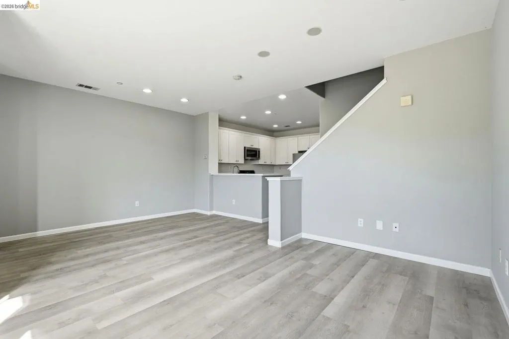 unfurnished living room featuring light wood-type flooring and recessed lighting