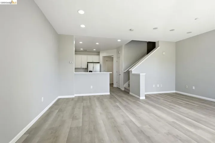 unfurnished dining area with light wood-type flooring and recessed lighting