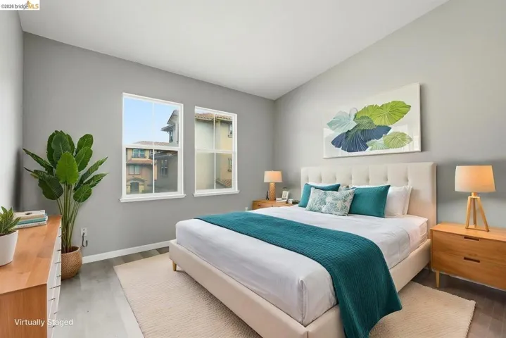 bedroom featuring light wood-style flooring - Virtual Staging