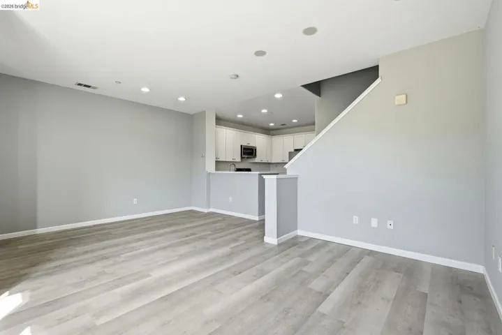 unfurnished living room featuring light wood-type flooring and recessed lighting