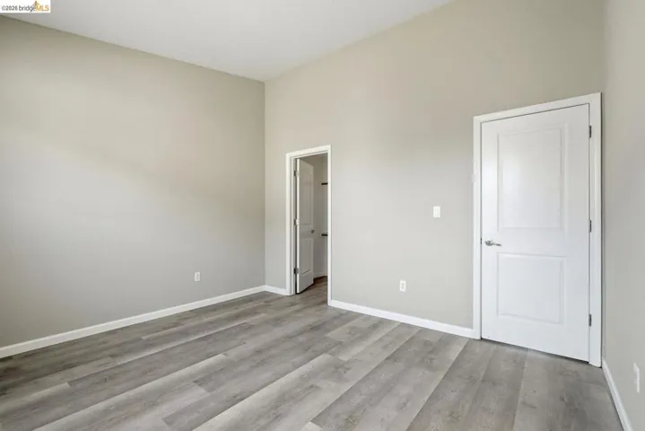 unfurnished bedroom with baseboards and light wood finished floors
