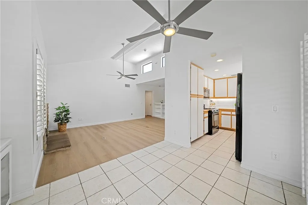 Dining area opens to kitchen. Ceiling fans throughout.