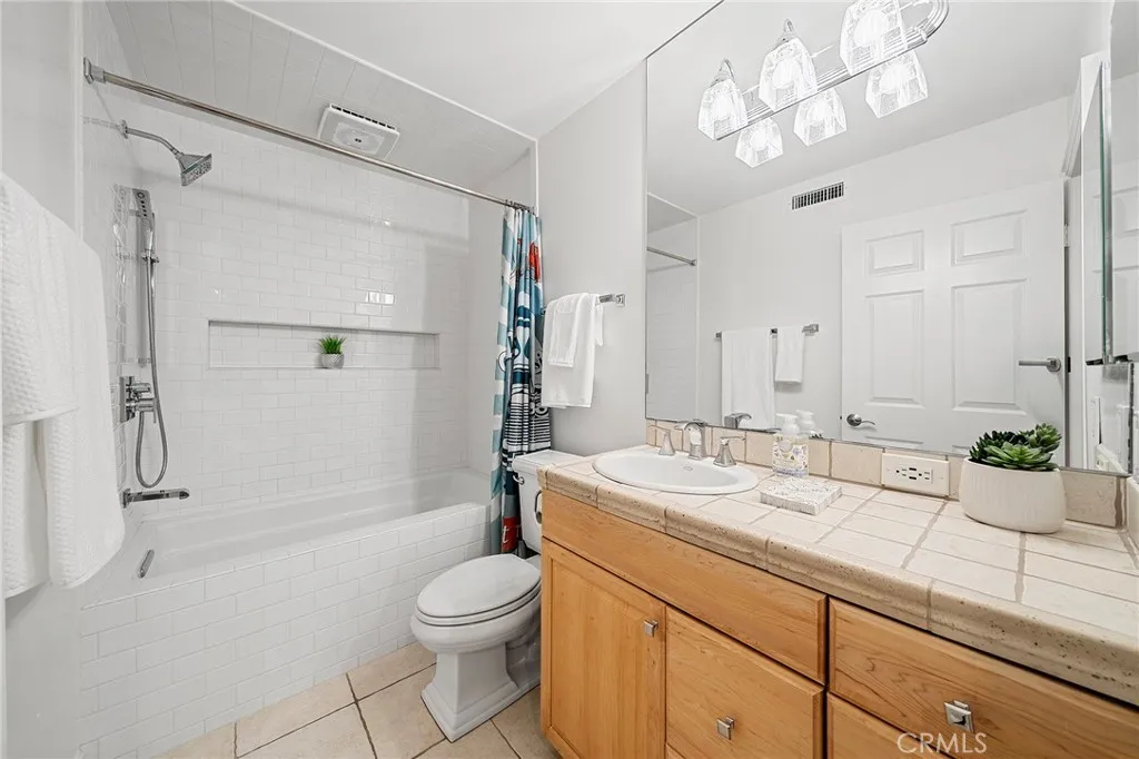 Super clean and upgraded guest bath with large soaking tub. Super bright.