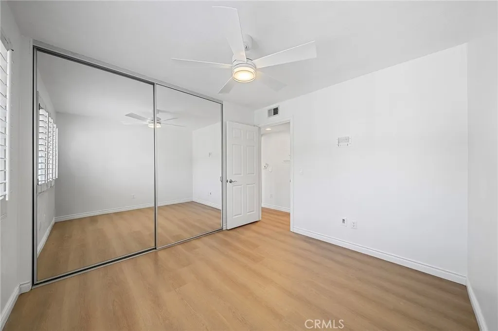 Closet with built-in organizers. New floors and paint.