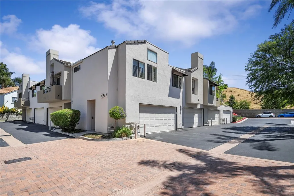 Garage is across from the main pool. Pool views from the living room and both bedrooms.