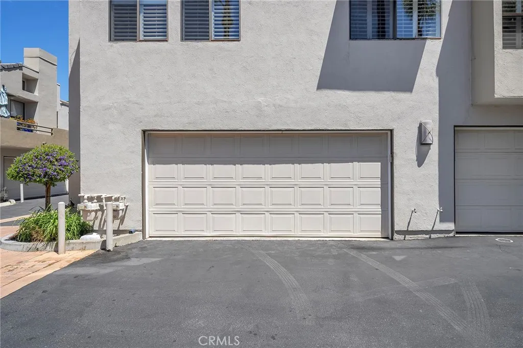 The direct access garage is at the end. Front door is right around the corner. The perfect location. Views of the main pool.
