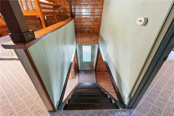 Top level looking down to living Room and front door.
