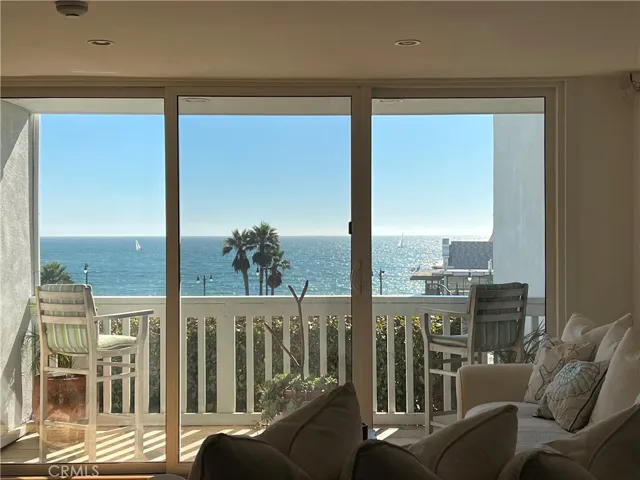 Spacious balcony with  Ocean and white water views.