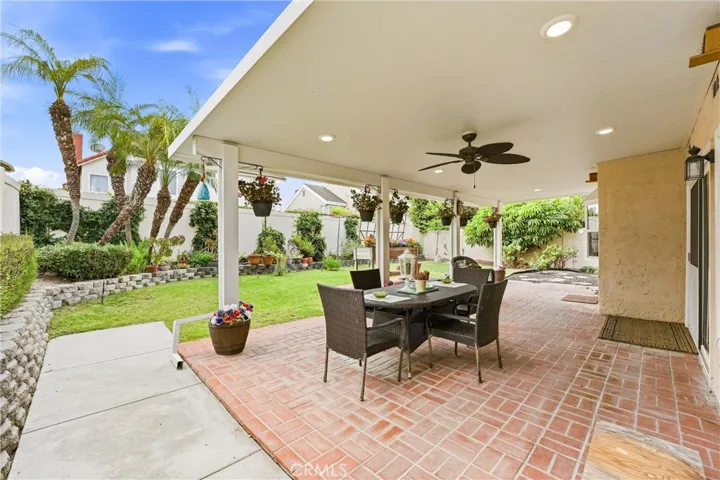 Great entertainers backyard, lights and fan in patio cover
