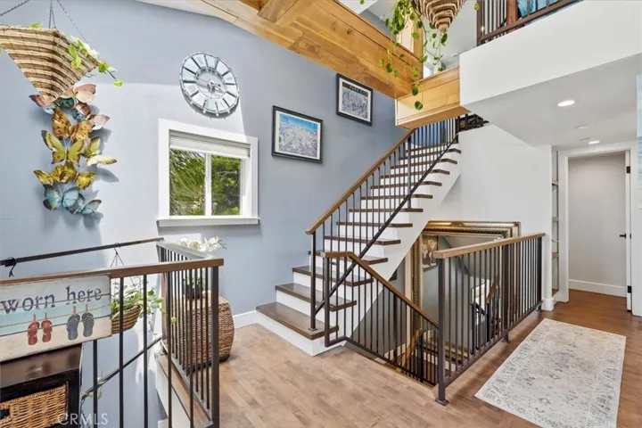 Down the stairs are Primary suites. Up the stairs is the loft.