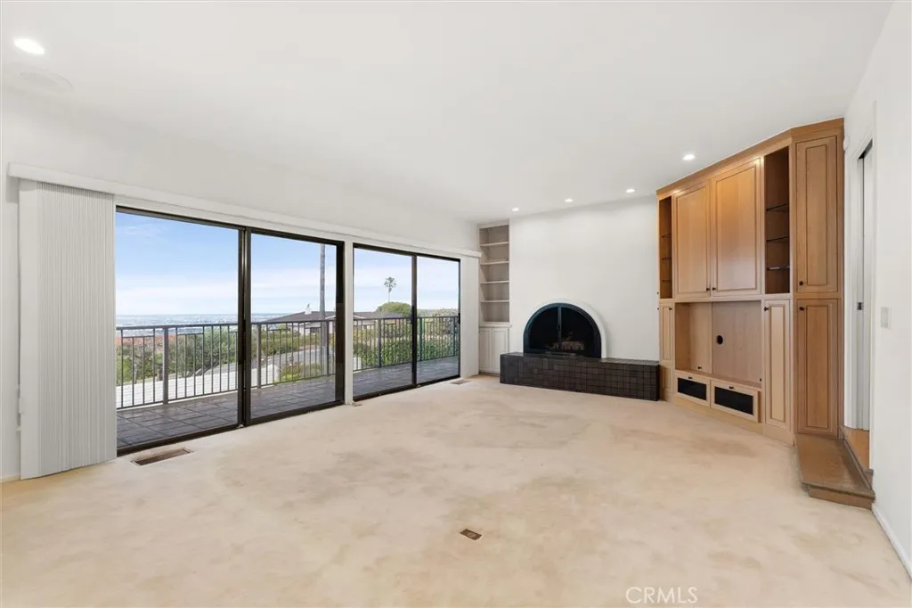 Family room with fireplace, built-ins and wet bar