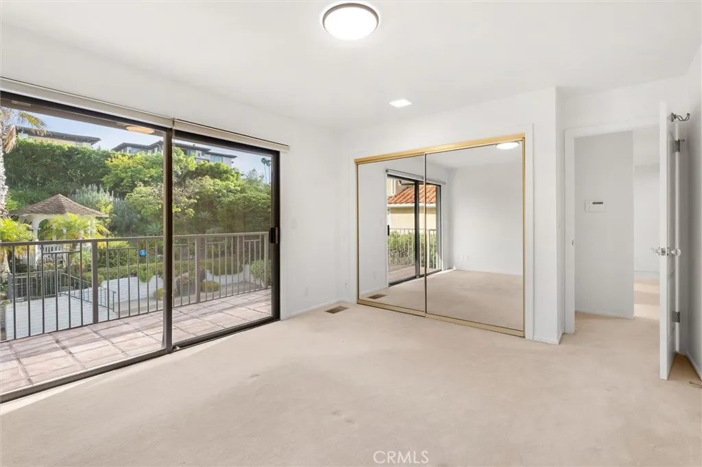 Bedroom # 3 with balcony overlooking yard