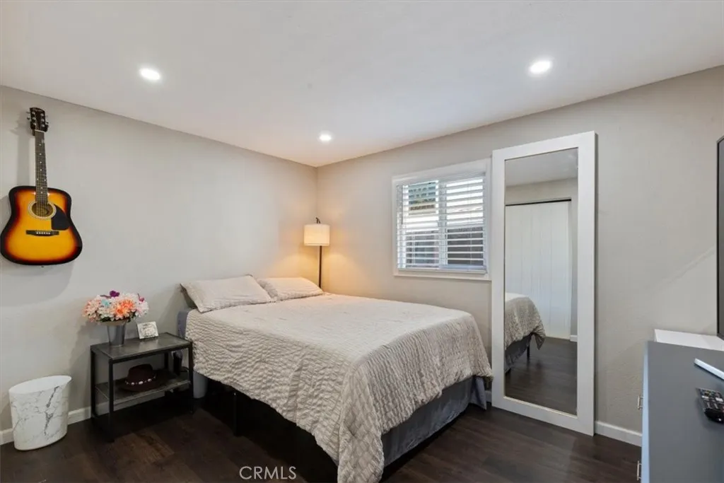 Bedroom 3: Flexible third bedroom with updated flooring, recessed lighting, neutral finishes, and space for bedroom, office, or study use.