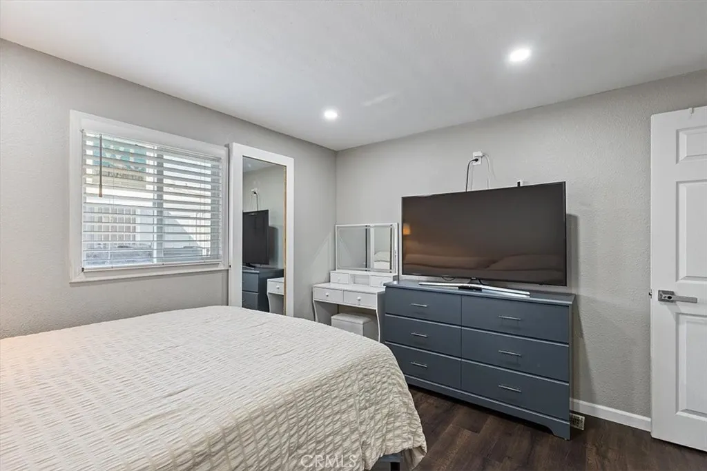 Bedroom 3: Flexible third bedroom with updated flooring, recessed lighting, neutral finishes, and space for bedroom, office, or study use.