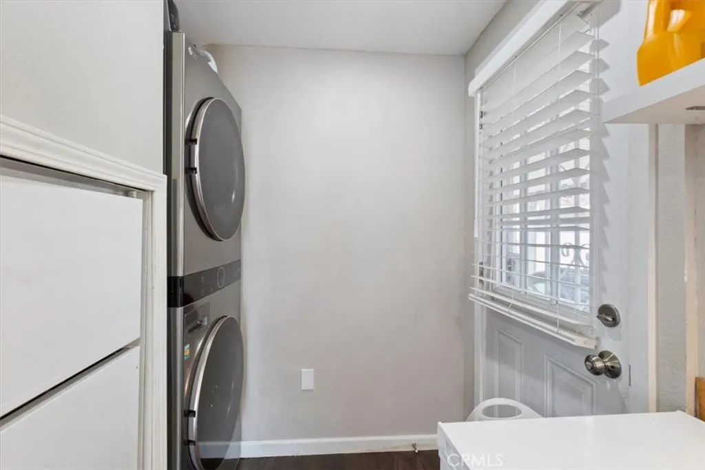 Laundry Area: Interior stackable washer/dryer space conveniently located near the kitchen and carport entry.