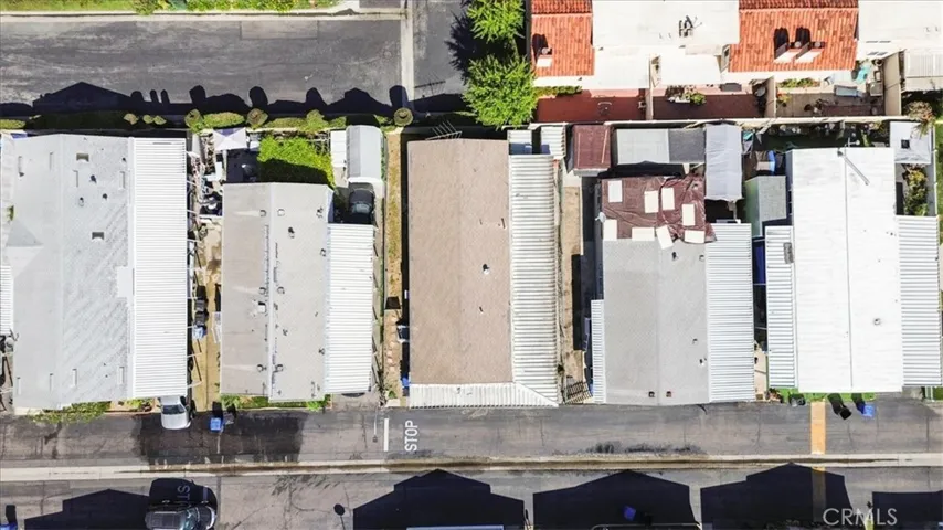 Drone View: Aerial perspective of the home’s location within Lincoln Center Mobile Home Park, an all-age Cypress community near local amenities, shopping, dining, entertainment, and convenient freeway access.