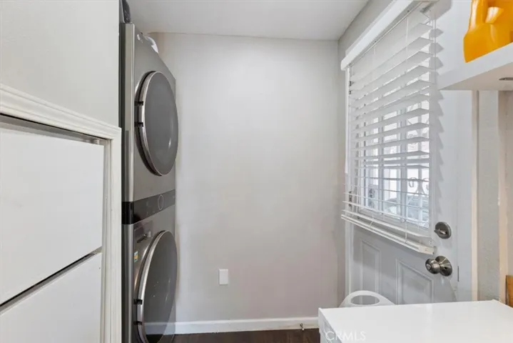 Laundry Area: Interior stackable washer/dryer space conveniently located near the kitchen and carport entry.
