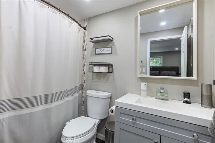 Second Bathroom: Roomy updated bathroom with shower/tub combo, modern vanity, and generous usable space.