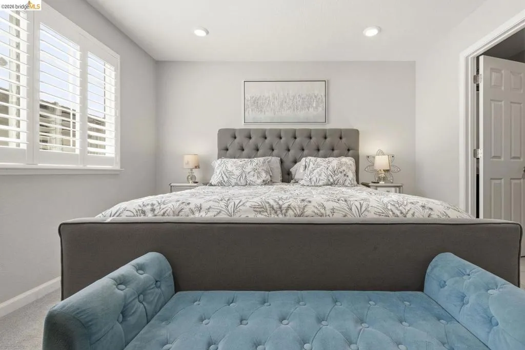bedroom with recessed lighting and carpet