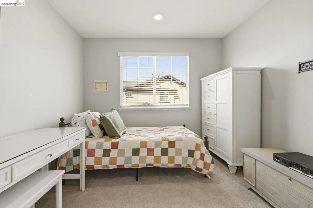bedroom with light carpet