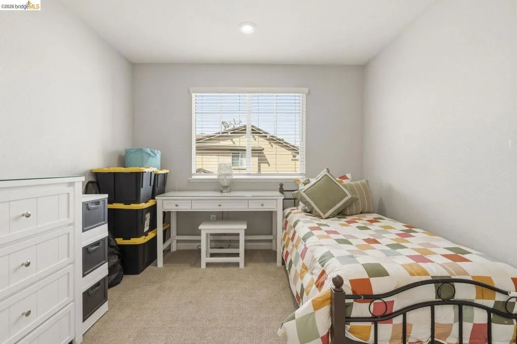 bedroom featuring light carpet
