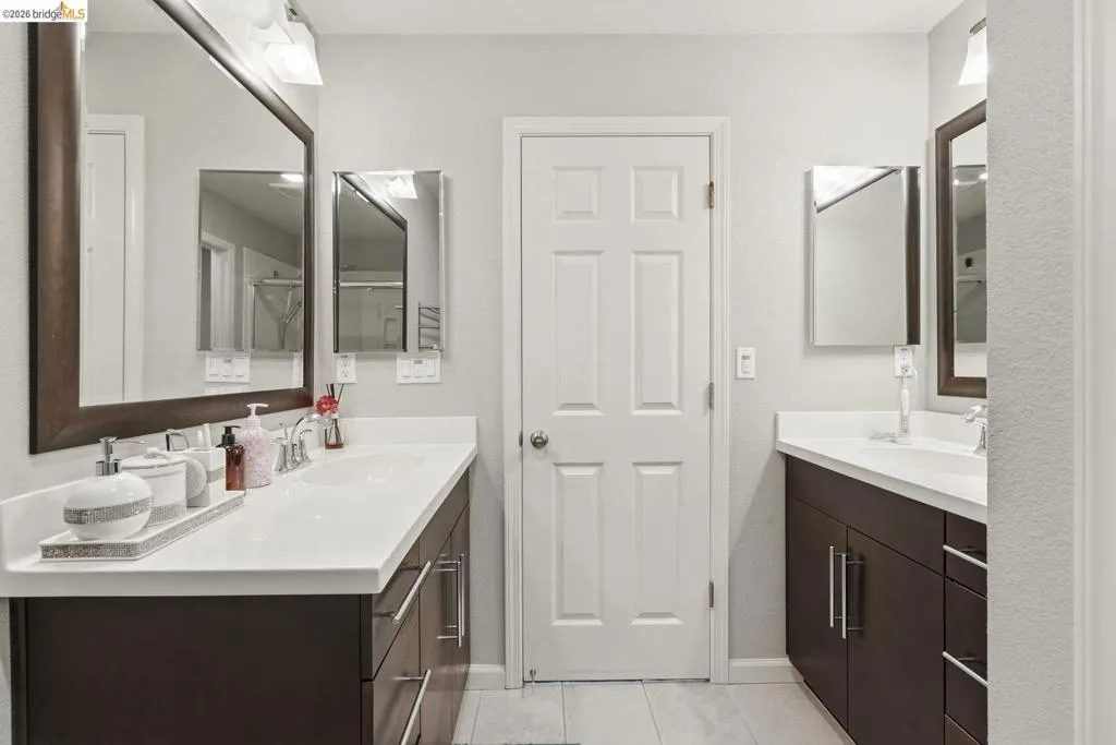full bath featuring two vanities