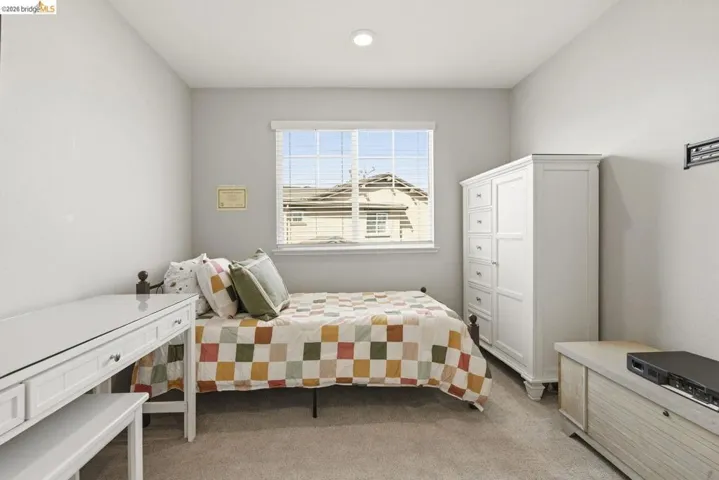 bedroom with light carpet