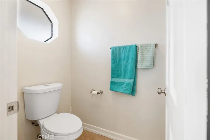 Behind the door is walk in shower