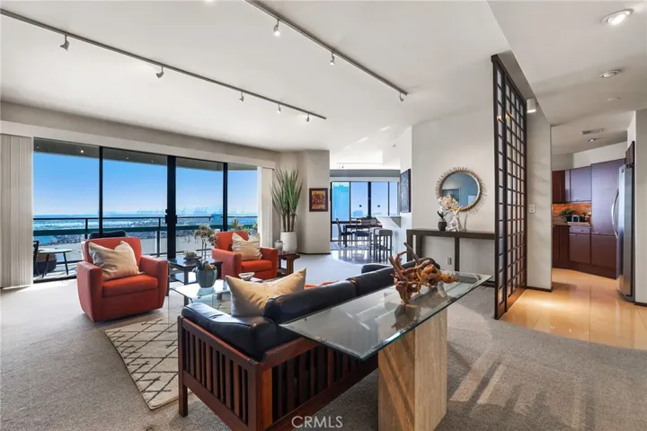 The living room transition seamlessly into the dining room and kitchen.