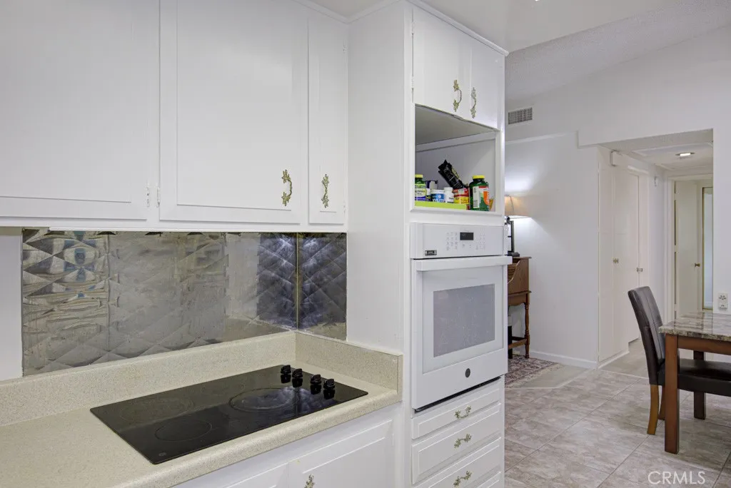 Another view of the kitchen. Dining area can be partially seen at right.