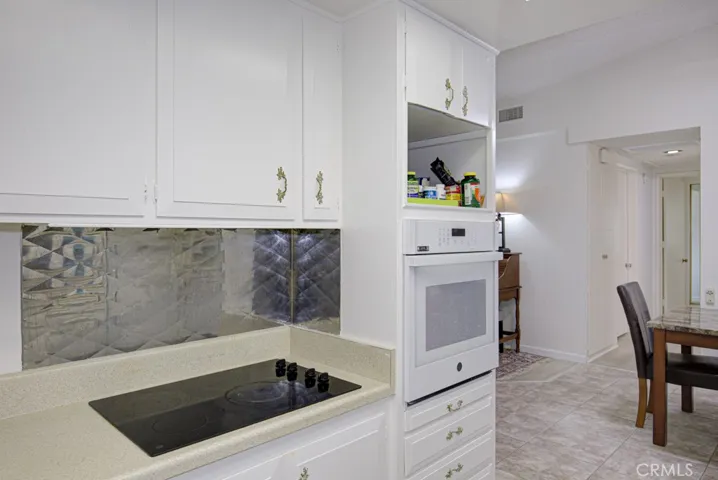 Another view of the kitchen. Dining area can be partially seen at right.