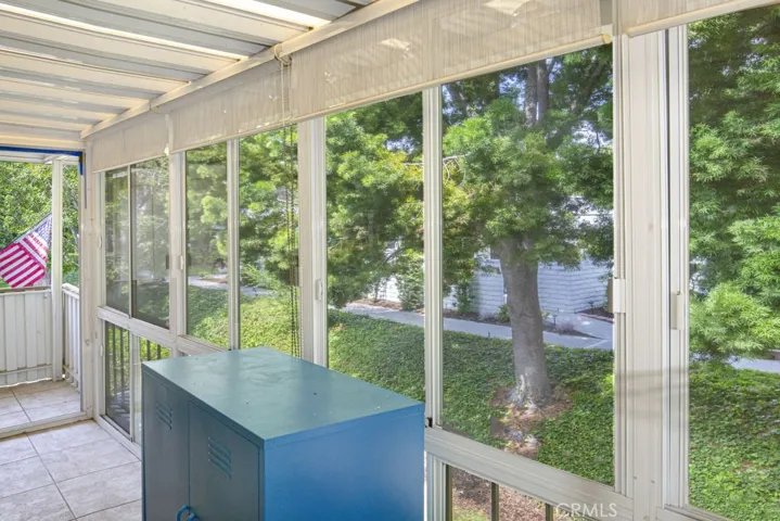 The balcony looks out upon several lovely shade trees giving this space a nice "treehouse" ambiance.