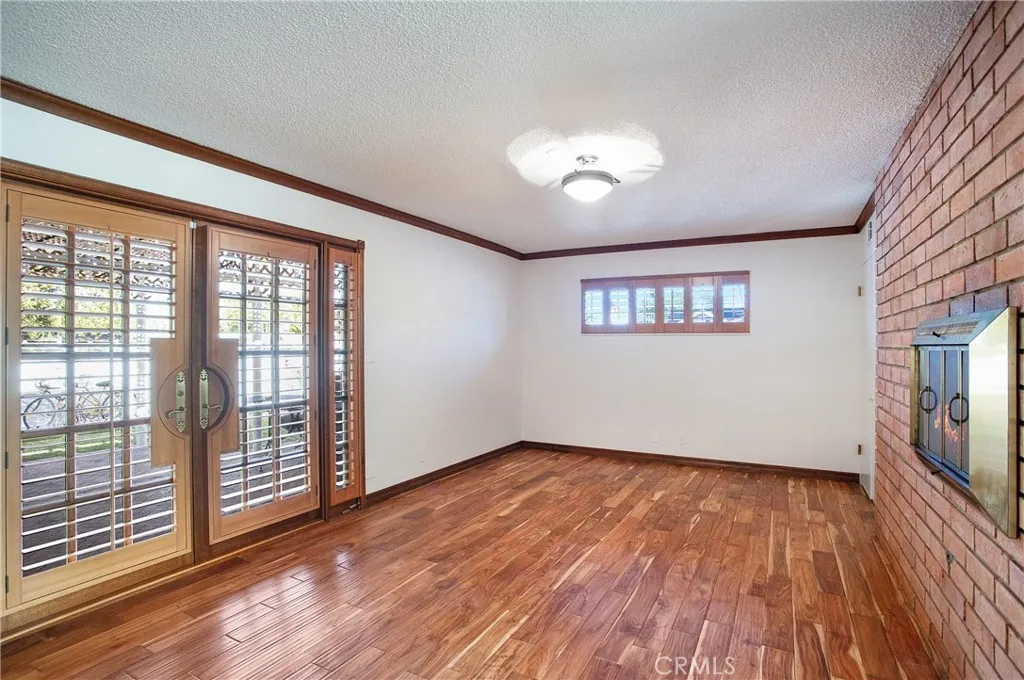 Dining room with dual fireplace and wood floors