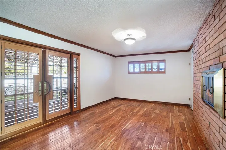 Dining room with dual fireplace and wood floors