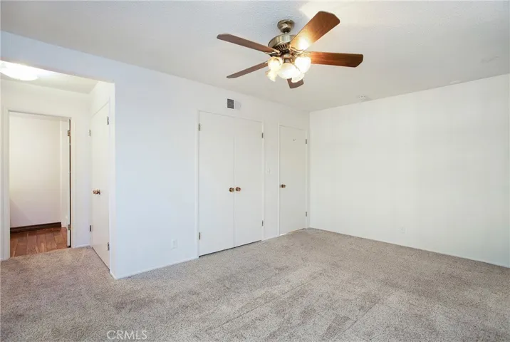 Master bedroom with dual closets