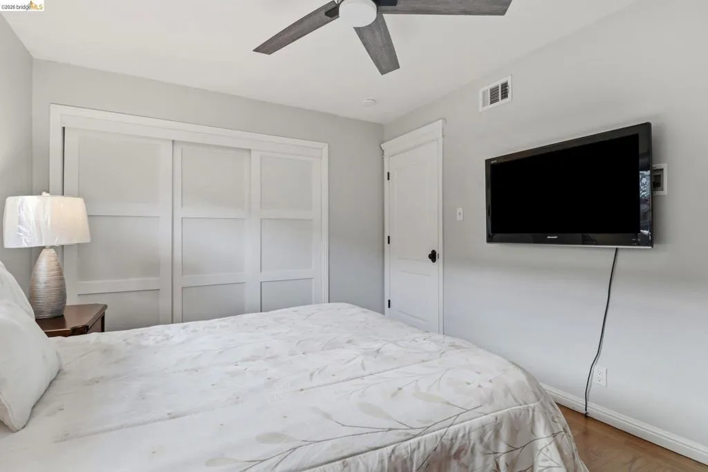 Hardwood-style flooring complementing light gray walls