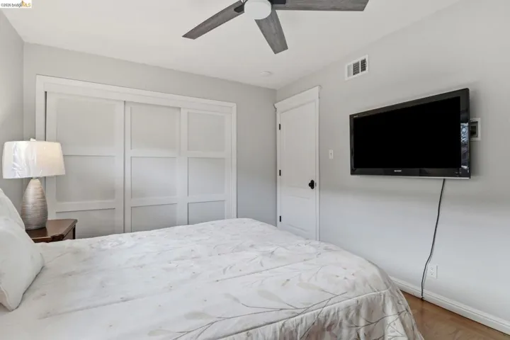 Hardwood-style flooring complementing light gray walls