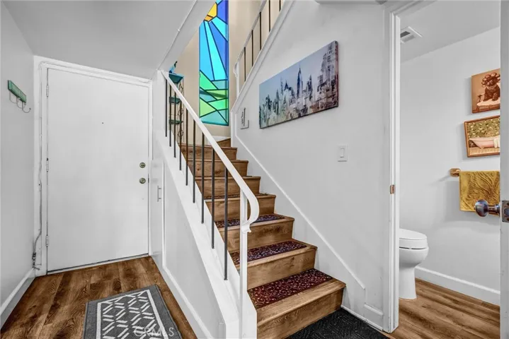 Staircase to 2nd flor and half bath