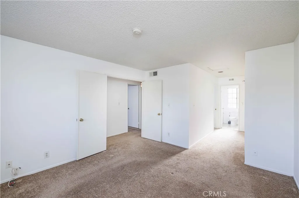 Primary suite hall to primary bath