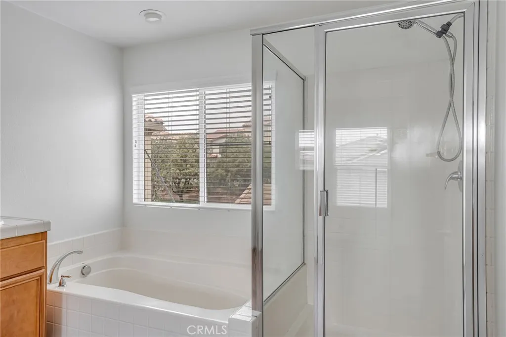 Master bath, provided bathtub and shower,