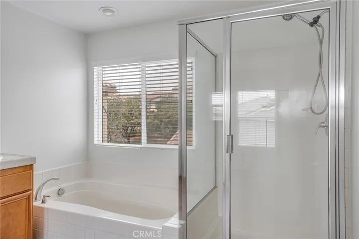 Master bath, provided bathtub and shower,