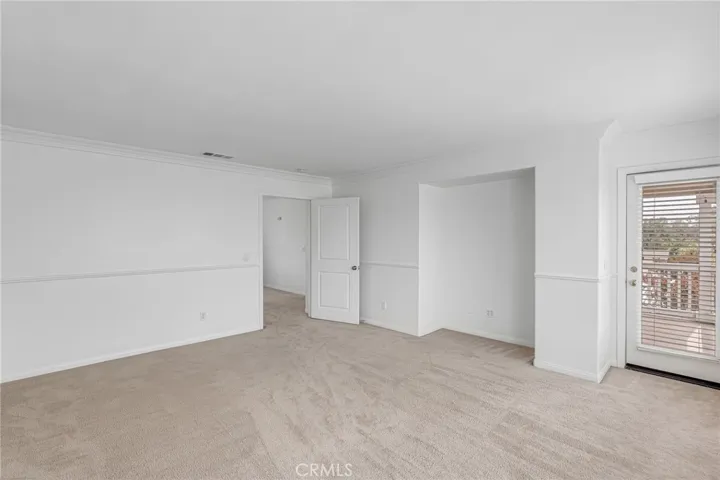 Another view inside the master bedroom and the door to a large balcony on the L