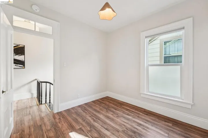 Spare room with wood finished floors and baseboards