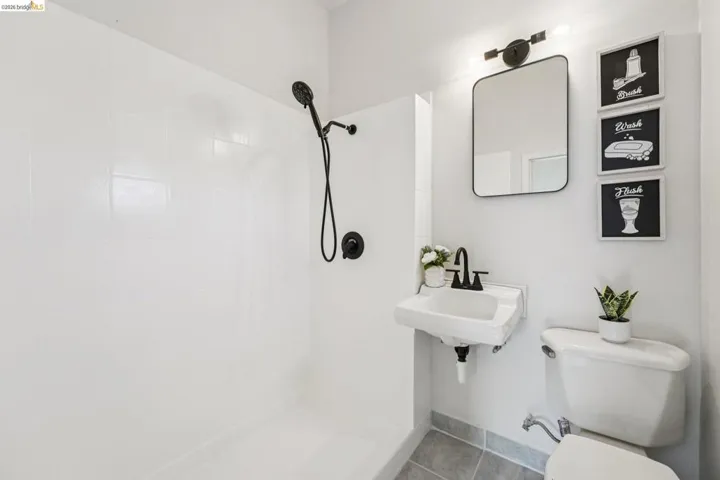 Bathroom featuring a tile shower and tile patterned floors
