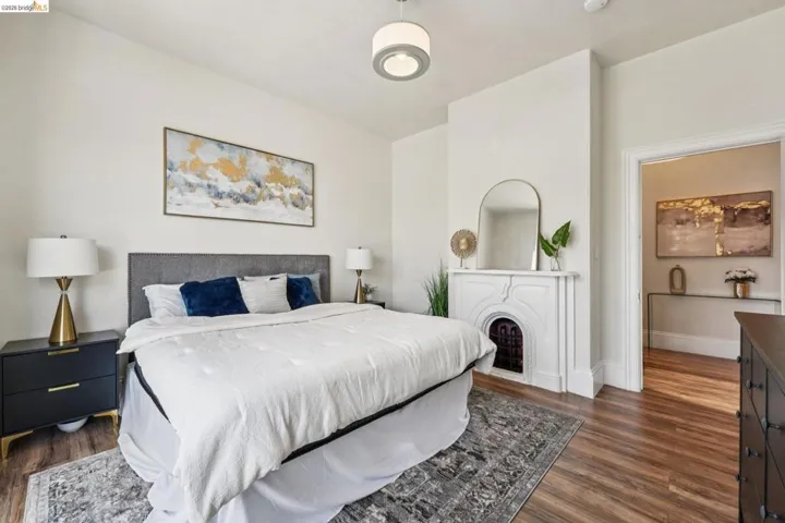Bedroom with dark wood-style flooring