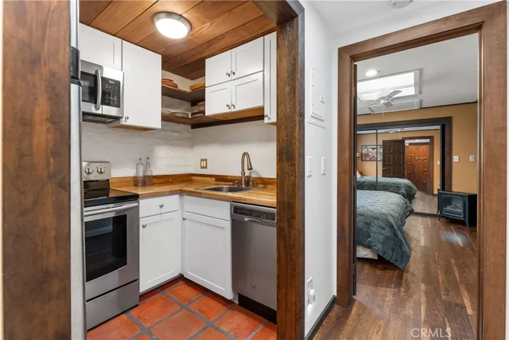 Main house guest suite kitchen to bedroom.