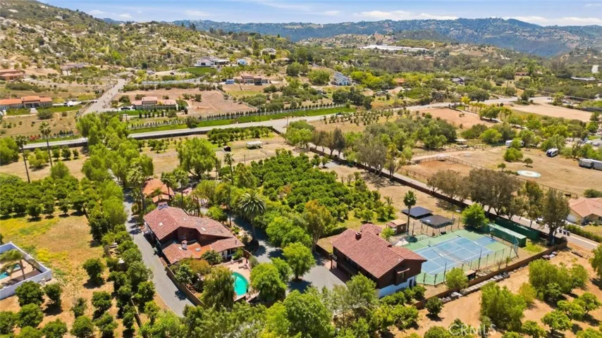 Main House w/Guest Suite, Guest House, Barn Pavillion, Corrals, Grove, Sports Court, Solar, Well, RV Parking & More!