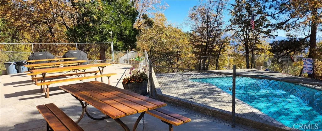 Country Club Pool With BBQ Area And Seating
