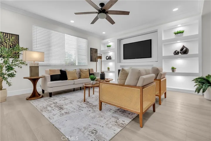 FAMILY ROOM WITH FIREPLACE & CABINETRY SHELVES