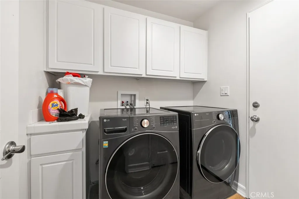 laundry and dryer on first floor next to garage
